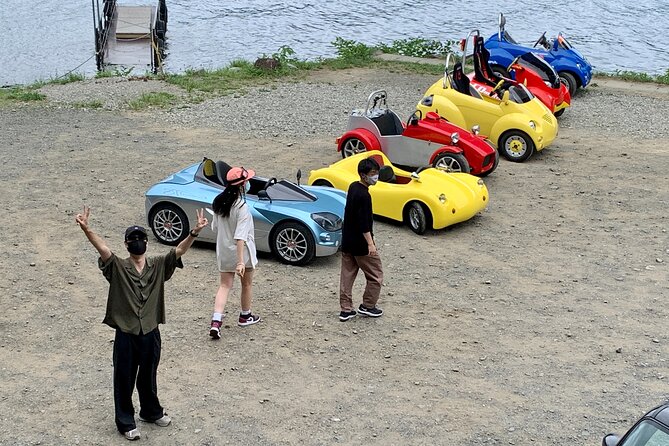 Cute & Fun E-Car tour following guide around Lake Kawaguchiko - Crossing Kawaguchiko Bridge with Fuji ahead