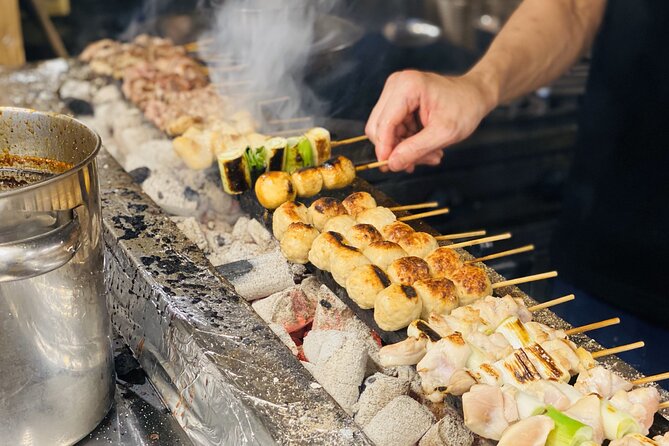 Japanese Food Experience Night Tour in Ueno - Izakaya dishes: sashimi, yakitori, and shared plates