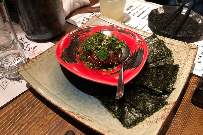 Sangenjaya Back Alleys Private Food and Drink Tour - Third stop: seafood, sashimi, and Japanese sake