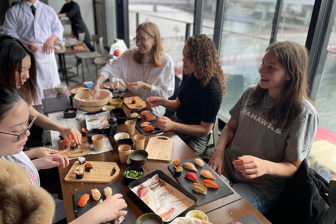 Sushi Making Tokyo Roll and Authentic Japanese Sushi Class - Shaping nigiri by hand