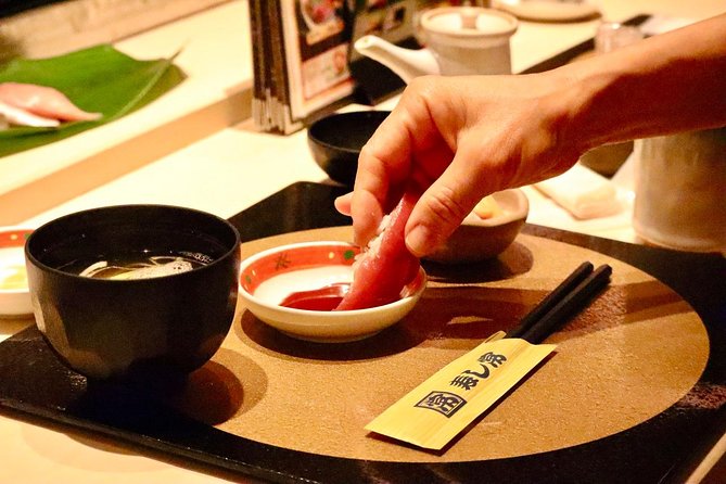 Tokyo: Food Tour in Ueno with 10+ Tastings of Japanese Classics - Eating beneath the elevated tracks