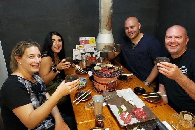 Tokyo Night Foodie Tour in Shinjuku - Seasonal Sushi, Wagyu Beef - Walking through Kabukicho after sunset