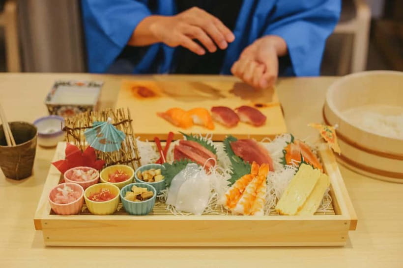Tokyo: Sushi Making Class in a Happi Coat near a Famous Spot - Putting on the happi coat